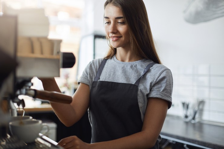 Woman working at coffee shop.