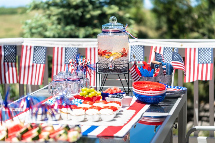 Fourth of July food and drink setup on patio.