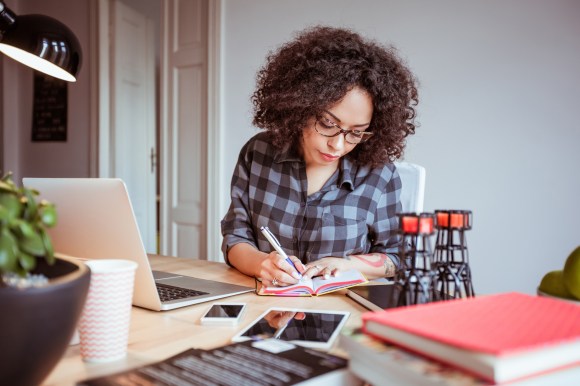 woman on laptop filing taxes