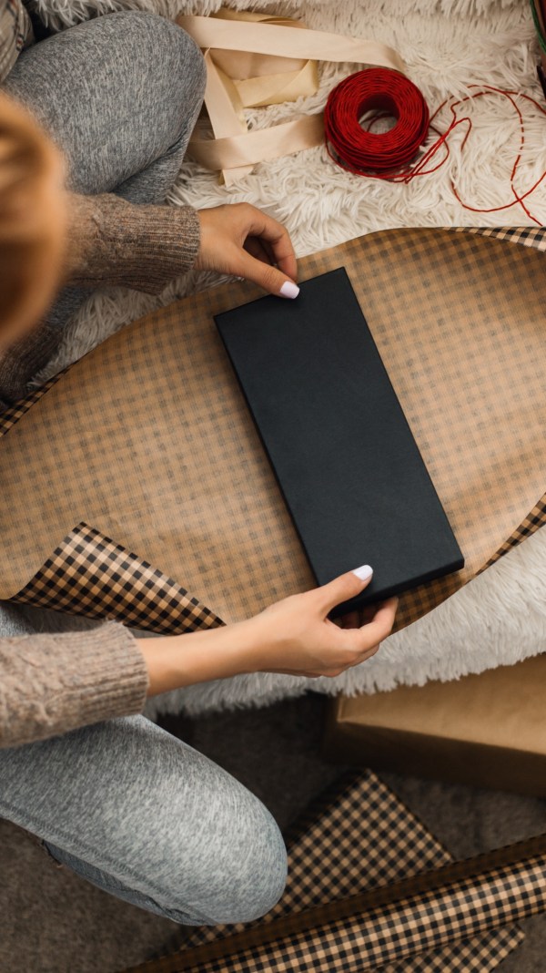 woman wrapping a gift