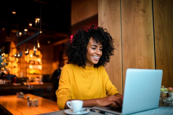 Woman filing taxes on laptop