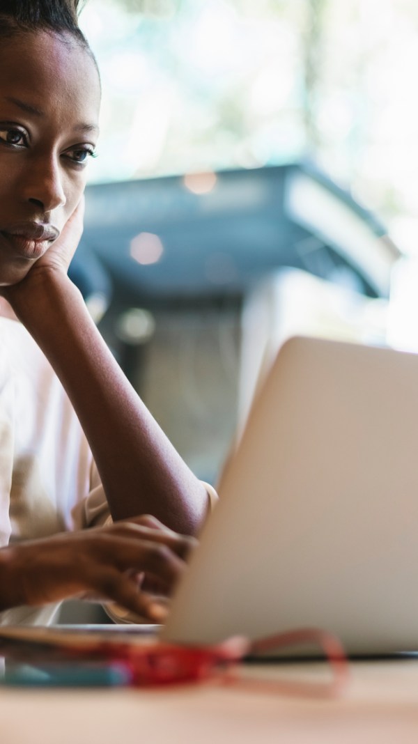 Woman reading about W-4 withholding certificate