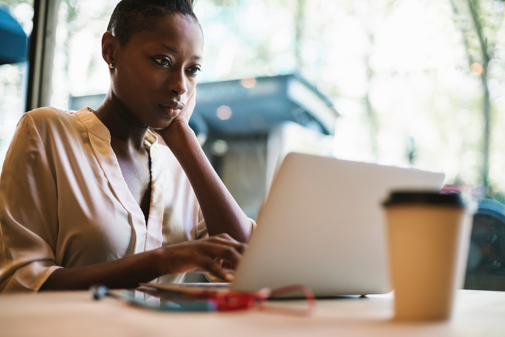 Woman reading about W-4 withholding certificate