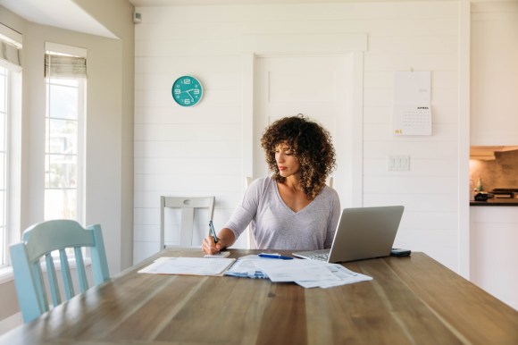 Woman calculating adjusted gross income