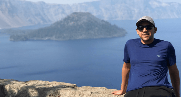 person sitting on mountain