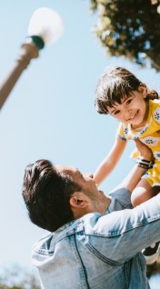 father and daughter outside