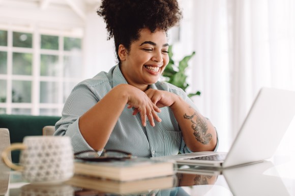 positive woman on computer