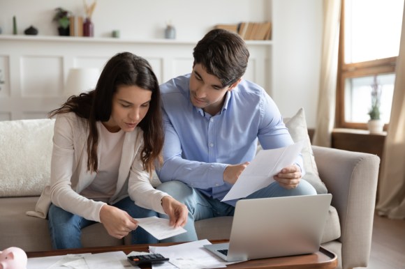 Couple reviewing expenses.