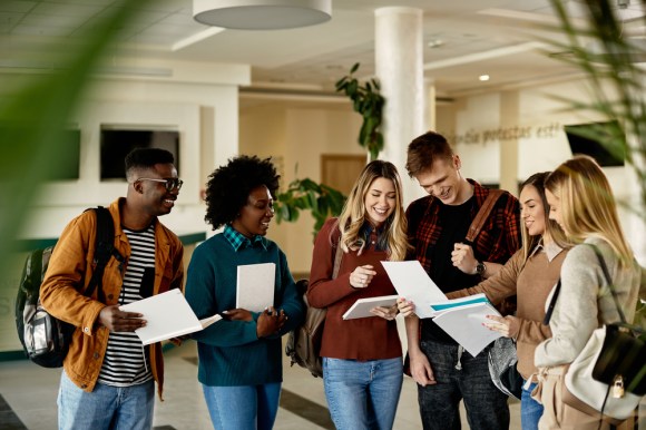 A group of students comparing test results on campus.