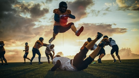  Football players in mid-game.