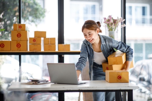 Young business owner handling shipments.