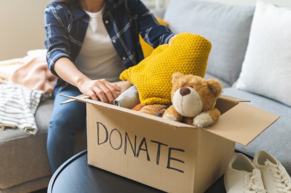 Box of toys and blankets for donation.

