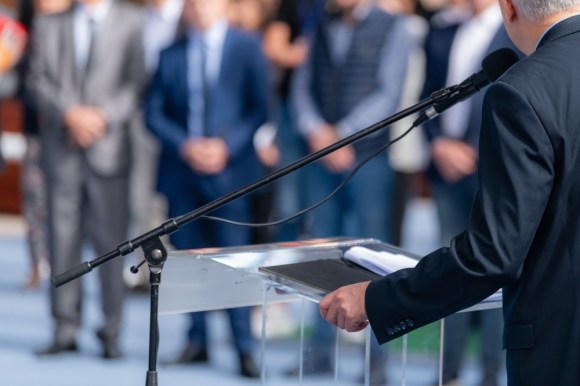 Political candidate giving a speech.