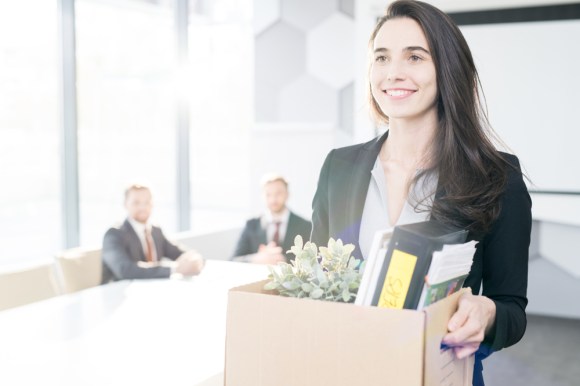 Woman leaving her job after quitting.