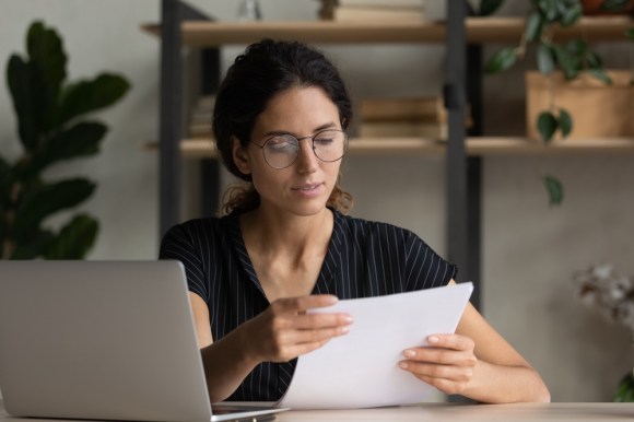 Woman looking over documents.