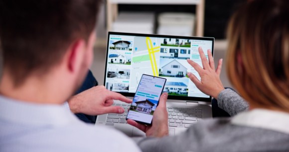  Couple looking up houses online.